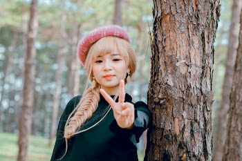 Blonde Haired Woman in Black Long-sleeved Top