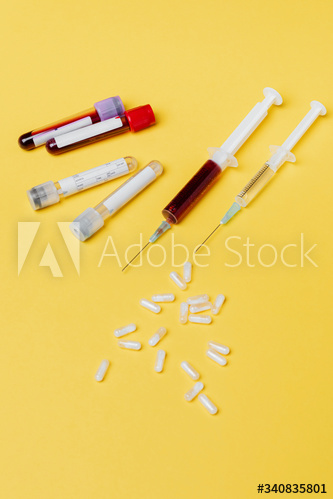 Blood test and vaccines on yellow background