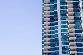blue and grey high-rise glass building
