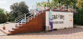 Blue and Purple Surfboard Besides White Ac Condenser