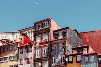 blue and red village under blue sky