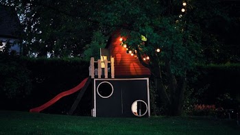 Blue and Red Wooden Play Yard at Night Time