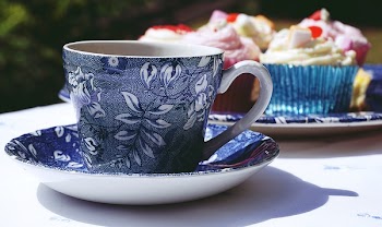 Blue And White Ceramic Mug And Saucer