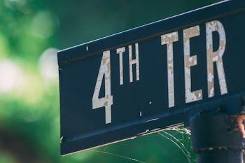 Blue and White Metal 4th Ter Signage