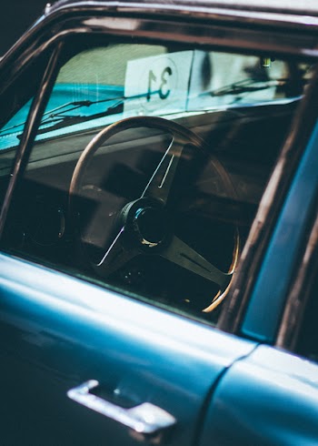 Blue Car With Black and Gray Steering Wheel