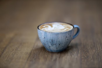 Blue Ceramic Coffee Cup on Brown Wooden Surface