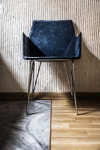 Blue Chair by the Beige Wall