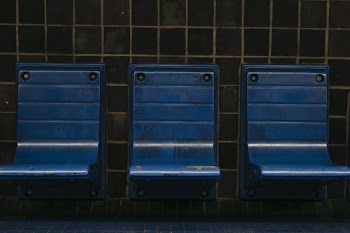 Blue Chairs On A Subway Platform