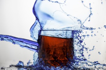 Blue Clear Glass Cup Splashed of Water