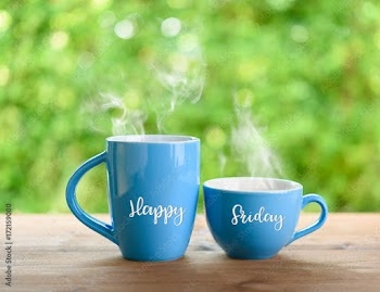 Blue Coffee cups and Happy Friday Quote on nature green  blurred  background
