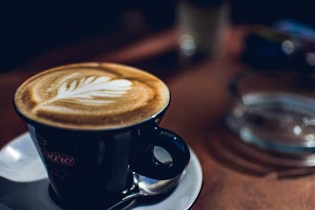 Blue Coffee Mug Near on Glass Ashtray
