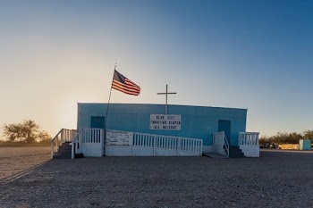 blue concrete building with USA flag