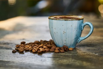 Blue Cup Near Coffee Beans