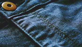 Blue Denim Textile With Brown Button