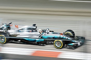 blue F1 behind white kart