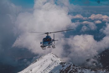 blue helicopter in the air