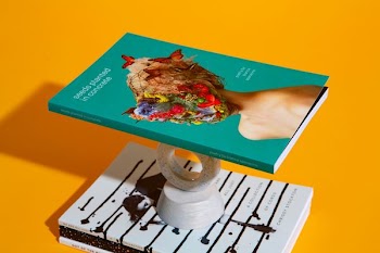 blue labeled book with stand
