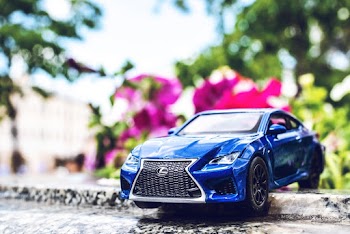 Blue Lexus Toy Car on the Street
