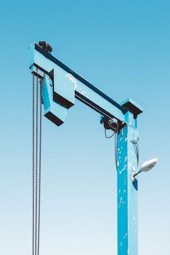 blue lift machine under blue skies