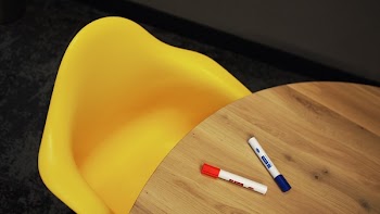 Blue Marker on Brown Wooden Table