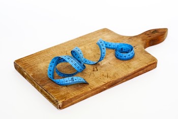 Blue Measuring Tape on Brown Wooden Chopping Board