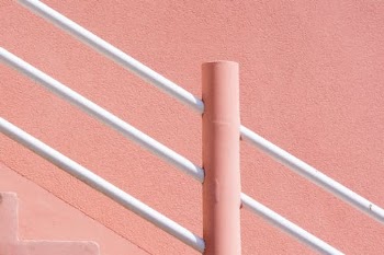 Blue Metal Bar Beside Brown Wall · Free Stock Photo