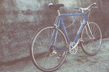 Blue Mountain Bicycle Beside Concrete Wall