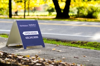 Blue Open House Stand Board on Concreted Road