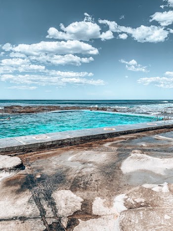 Blue Sea Under a Cloudy Sky