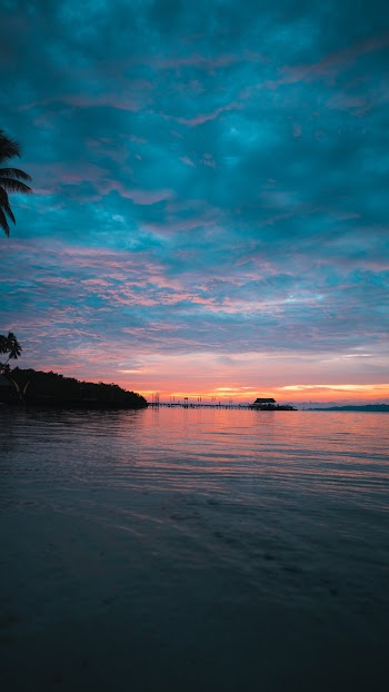Blue Sea Under Cloudy Sky during Golden Hour