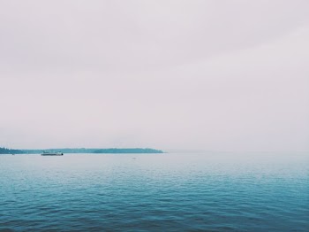 blue sea under gray sky