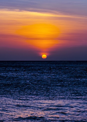 Blue Sea Under Yellow Sky