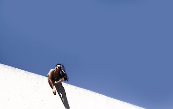 Blue Sky Behind Wall With Woman