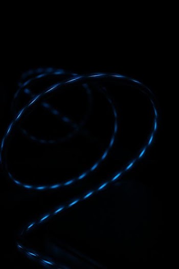 blue strip light turned on in dark room