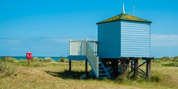 Blue Structure With Red Mailbox
