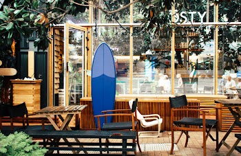 Blue Surfboard Leaning on Desk
