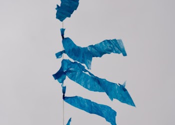 Blue Textiles Across Gray Clouds