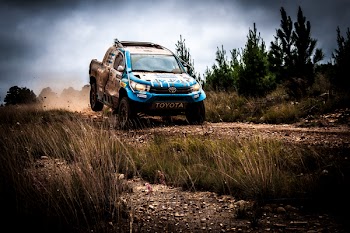 Blue Toyota Pickup Truck On Dirt Road