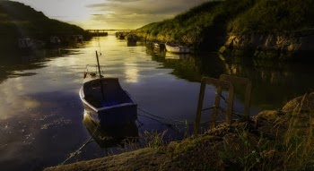 Blue Wooden Boat in Body of Water