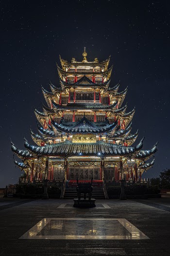 Blue, Yellow, and Green Lighted Pagoda Tower