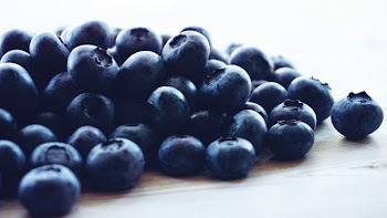 Blueberries Lot Above Beige Wooden Surface