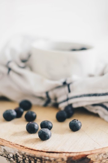 Blueberries outside of a bowl