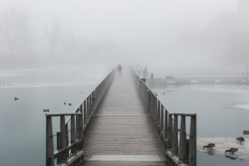 Boardwalk On Foggy Waters