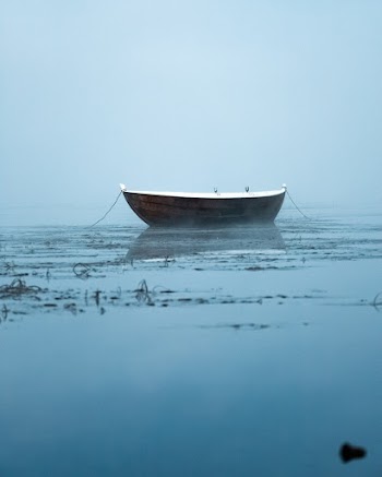 Boat Anchored in Water