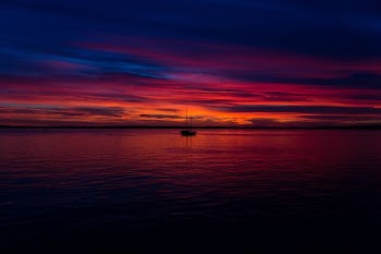 boat on body of water during golden time