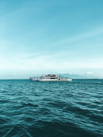 Boat on Ocean Under Blue Sky