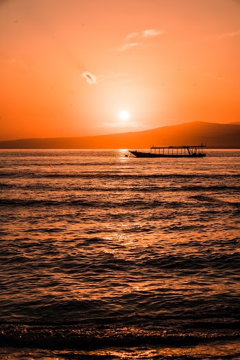 Boat on Sea during Sunset