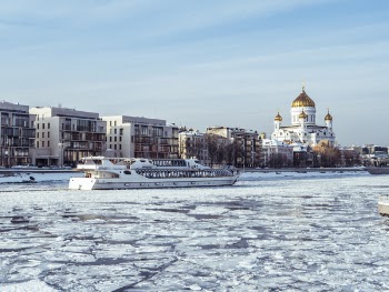 Boat on Water Beside City