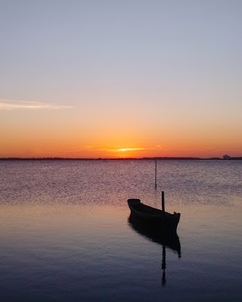Boat on Water during Sunset
