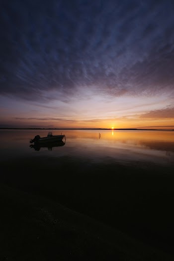 Boat on Water in Silhouette Photography